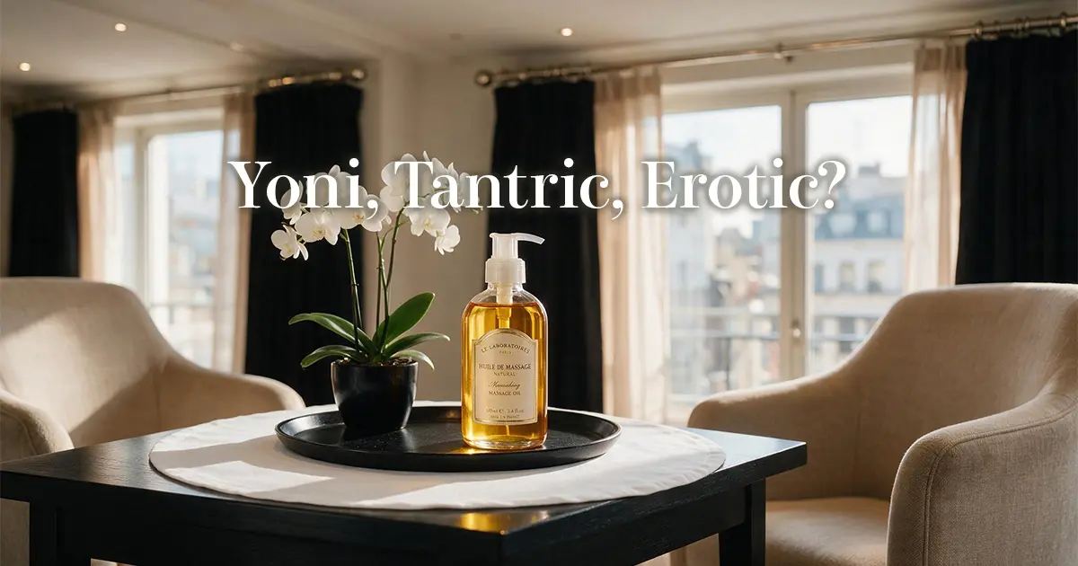 Massage oil and a white orchid beside a window in soft natural light